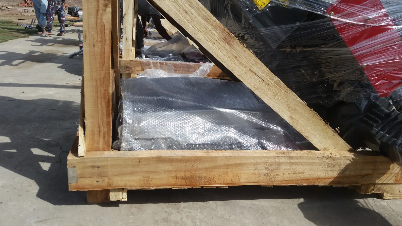 Tractor export loading with wooden packing for container shipment