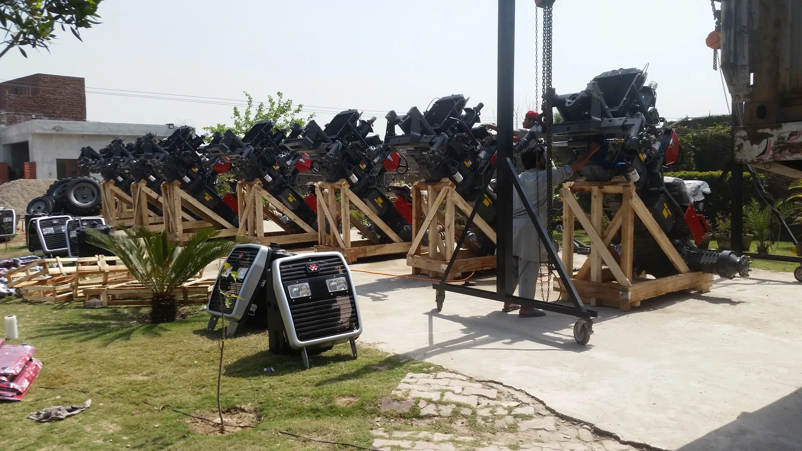 Export packing yard with tractor parts and shipment preparation