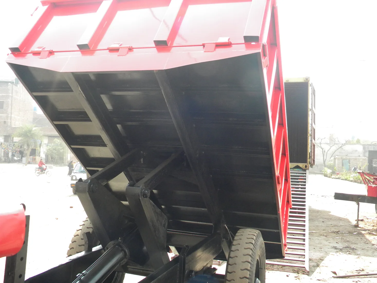 Hydraulic tipping trailer raised body showing tipping mechanism